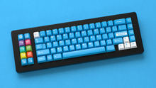 Load image into Gallery viewer, render of Unobtanium Blue on a black NK Plus keyboard on a blue background