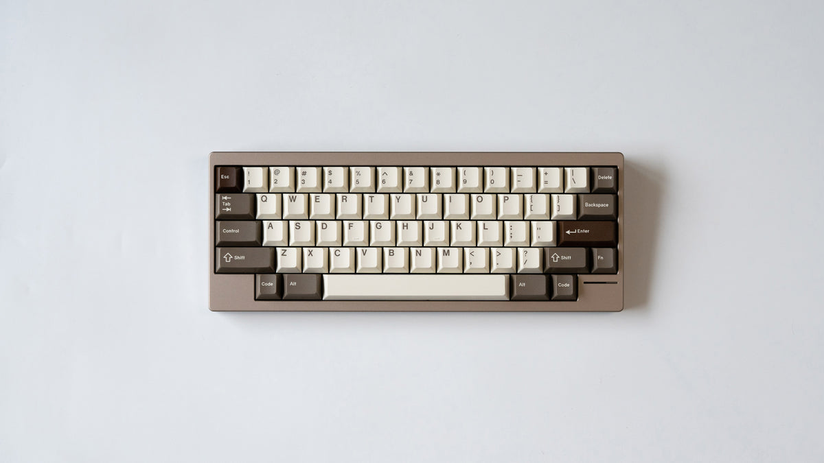  taupe lily top down featuring some keycaps 
