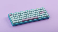 Load image into Gallery viewer, Key kobo Glacier on a blue keyboard