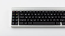 Load image into Gallery viewer, KAM Playground on a silver keyboard close up on left side