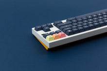Load image into Gallery viewer, KAT Dark Milkshake on a white and yellow keyboard back view