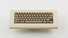 Load image into Gallery viewer, Key Kobo Signet on a beige keyboard