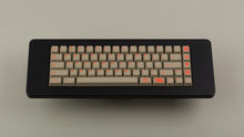 Load image into Gallery viewer, Key Kobo Signet on a black keyboard