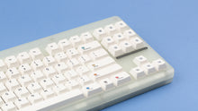 Load image into Gallery viewer, Keycapsule Prism on a CLASSIC-GLO keyboard close up up on right side angled