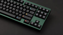 Load image into Gallery viewer, Keycapsule Prism on a green Keycult No. 1 close up on right side