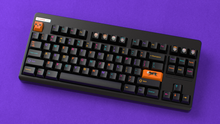 Load image into Gallery viewer, render of GMK Mictlan Rebirth in CYL on a black CLASSIC-TKL angled ona purple background
