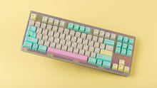 Load image into Gallery viewer, Keycult No. 1 / TKL Series 22 with keycaps on yellow background angled