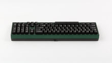 Load image into Gallery viewer, green case featuring white on black keycaps back view