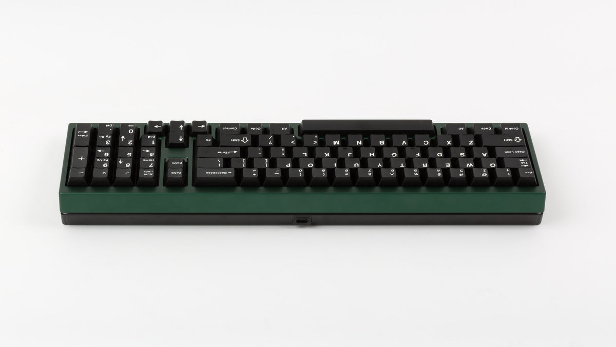 green case featuring white on black keycaps back view