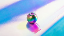 Load image into Gallery viewer, titanium orb on an iridescent background