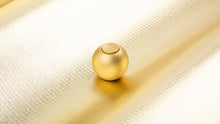Load image into Gallery viewer, brass orb on a gold background