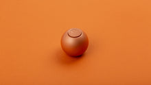 Load image into Gallery viewer, Copper orb on orange background