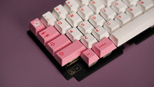 Load image into Gallery viewer, Mechanical keyboard with pink and white keys on a purple background