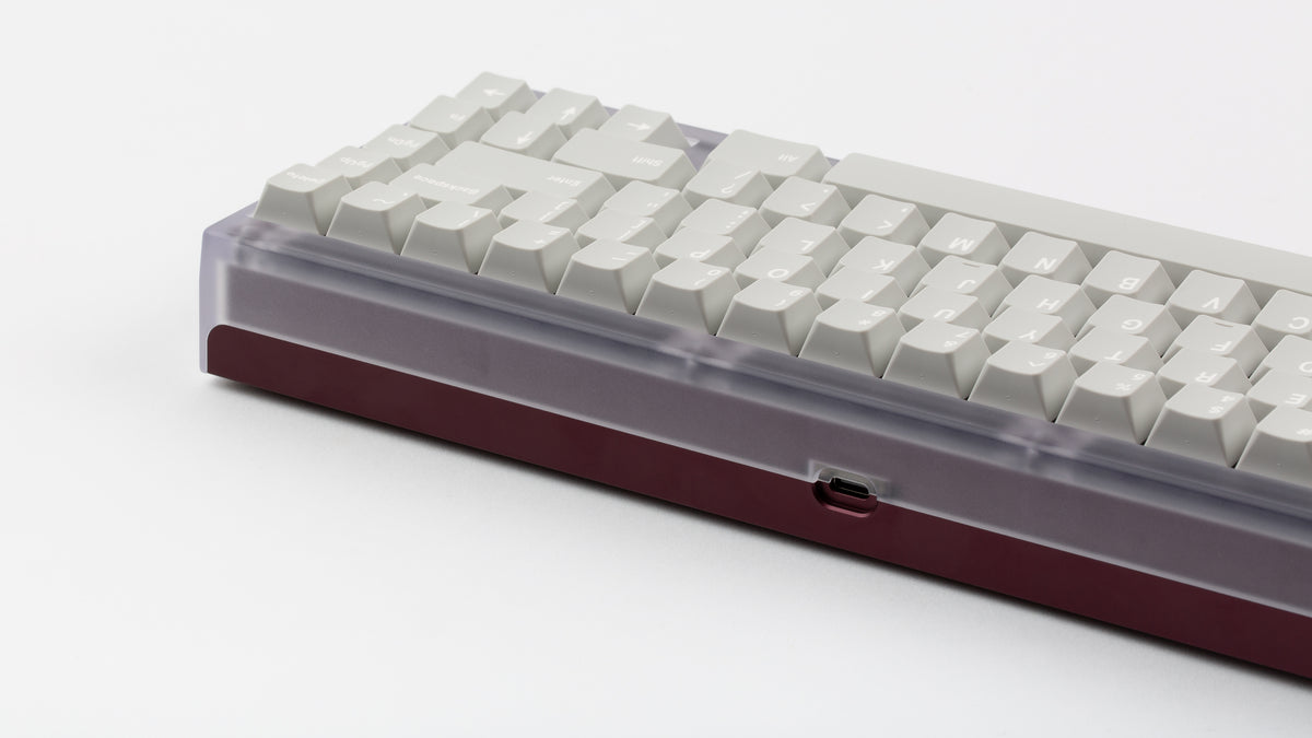  Keycult No. 2/65 with polycarbonate top and Purple Violet bottom with GMK CYL Modern materials keycaps back view close up on right side angled 