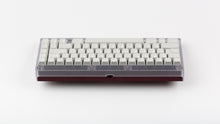 Load image into Gallery viewer, Keycult No. 2/65 with polycarbonate top and Purple Violet bottom with GMK CYL Modern materials keycaps back view