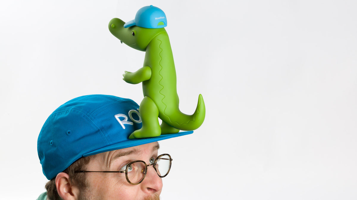  model posing with a vinyl ron on his hat wearing a Blue Ron Hat 