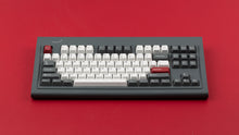 Load image into Gallery viewer, Smurve80 keyboard in Graphite front view on red surface