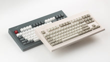 Load image into Gallery viewer, Smurve80 keyboards in Graphite and Sandstone colorways side by side