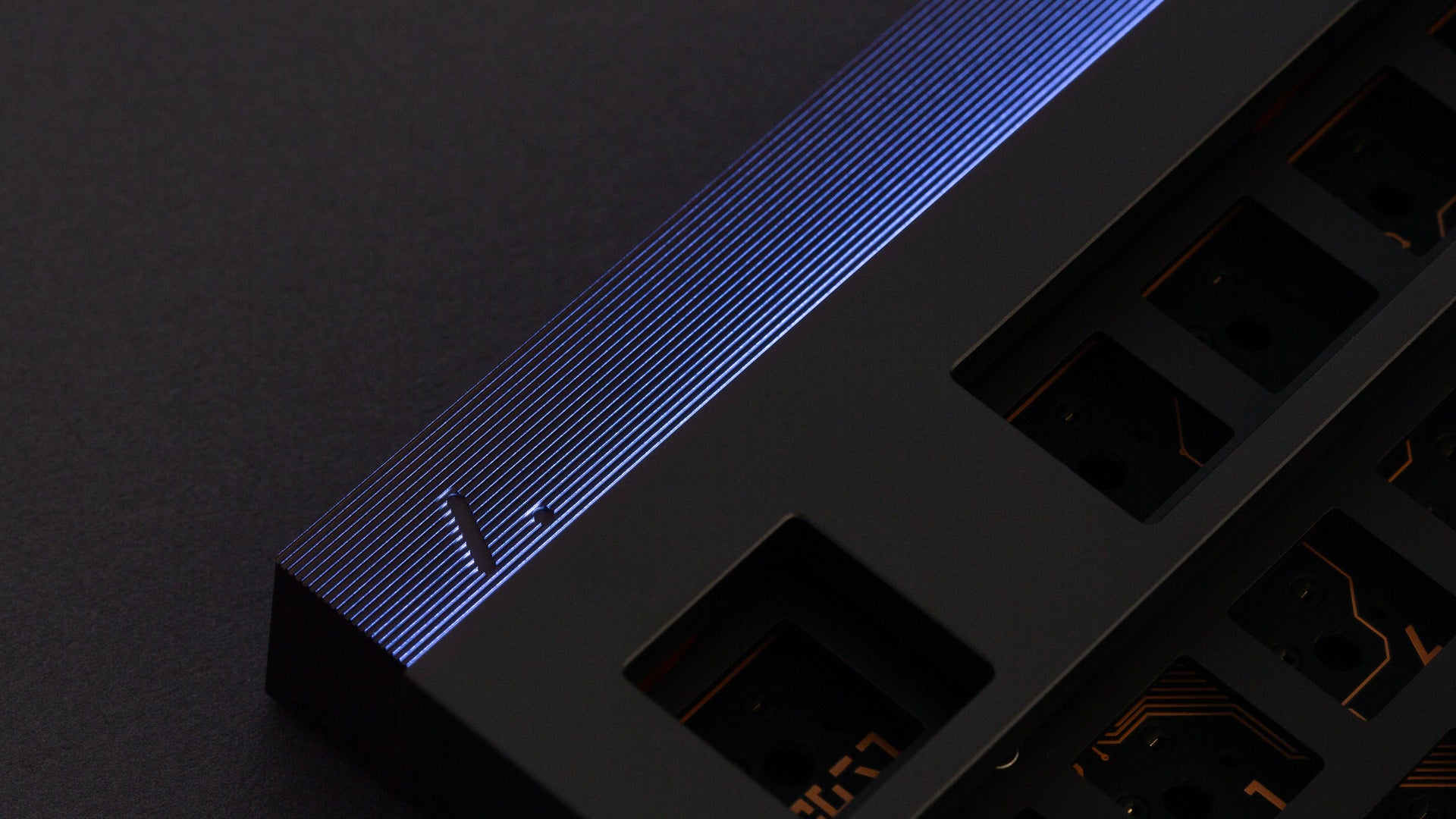 Artifact Stratum 80 light guide LED strip glowing blue along the ribbed top edge