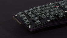 Load image into Gallery viewer, Anodized black Type-K with plate and weight zoomed in on left featuring dark gray switches