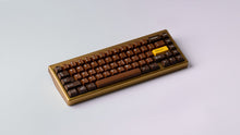 Load image into Gallery viewer, Render of GMK CYL Chocolatier keycaps on a dark keyboard, close-up showing the rich chocolate brown color palette
