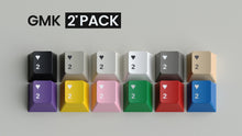 Load image into Gallery viewer, Render of the GMK 2Pack keycap set - twelve heart-2 keycaps in twelve colors with the GMK 2Pack logo