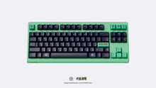 Load image into Gallery viewer, MONOKEI Standard - Megumi Edition featuring dark purple and green Double shot PBT Series 1 keycaps