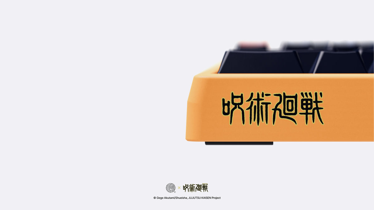  MONOKEI Standard - Yuji Edition zoomed in on front left corner featuring dark purple and orange double shot PBT Series 1 keycaps 