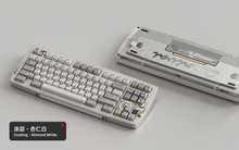 Load image into Gallery viewer, Render of Matrix Carnival keyboard in Coated Almond White, showing front with keycaps and back with decorative weight