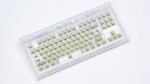 Load image into Gallery viewer, Smurve80 First Light angled view showing the frosted case and clear keycaps