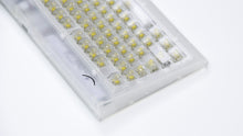 Load image into Gallery viewer, Close-up of Smurve80 First Light frosted case edge and smile logo