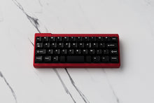 Load image into Gallery viewer, CYL WoB Extensions on a red keyboard centered