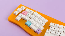 Load image into Gallery viewer, DSA Milkshake on an orange keyboard zoomed in left