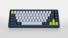 Load image into Gallery viewer, GMK CYL Grand Prix on a blue keyboard centered