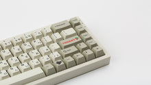 Load image into Gallery viewer, GMK CYL Classic Retro Zhuyin on a beige NK65 zoomed in on right