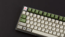 Load image into Gallery viewer, Ghostbustin PBT Keycaps on a NK87 smoke keyboard zoomed in on left