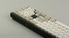 Load image into Gallery viewer, GMK CYL Hineybeige on a green keyboard back view