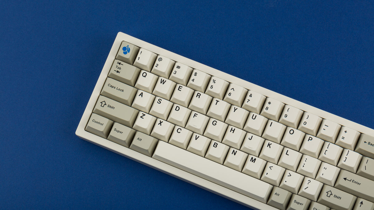  GMK CYL Hineybeige on a beige NK65 keyboard close up on left 