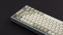 Load image into Gallery viewer, GMK CYL Hineybeige on a silver 7V keyboard back view