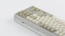 Load image into Gallery viewer, GMK CYL Hineybeige on a silver keyboard back view on right side