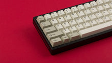 Load image into Gallery viewer, GMK CYL Hineybeige on a black and red keyboard close up on left side