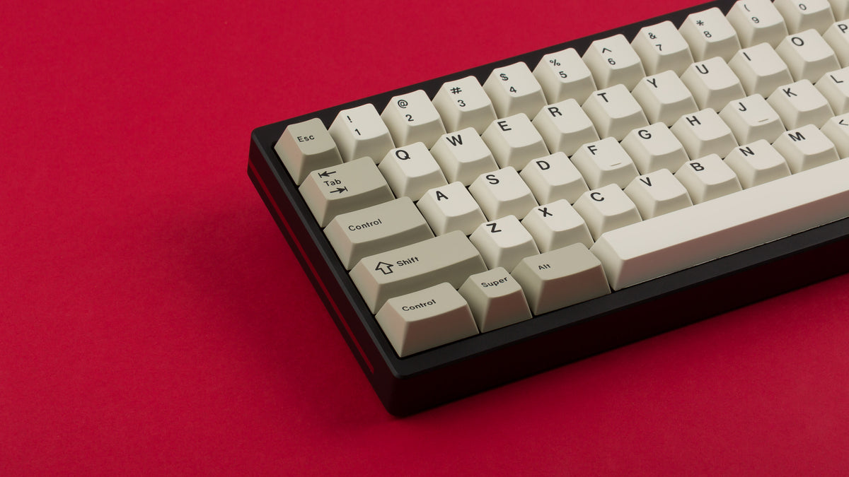  GMK CYL Hineybeige on a black and red keyboard close up on left side 