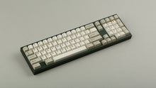 Load image into Gallery viewer, GMK CYL Hineybeige on a green keyboard angled