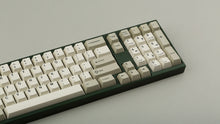 Load image into Gallery viewer, GMK CYL Hineybeige on a green keyboard close up on right
