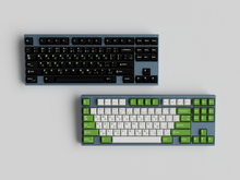 Load image into Gallery viewer, JTK Griseann on a grey keyboard on top with JTK Royal Alpha on a gray keyboard below