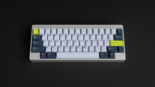Load image into Gallery viewer, GMK CYL Grand Prix on a silver keyboard centered