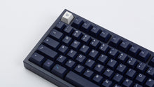 Load image into Gallery viewer, dark blue NK87 case with included dark milkshake themed keycaps  close up left side