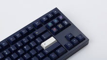 Load image into Gallery viewer, dark blue NK87 case with included dark milkshake themed keycaps  close up of right side