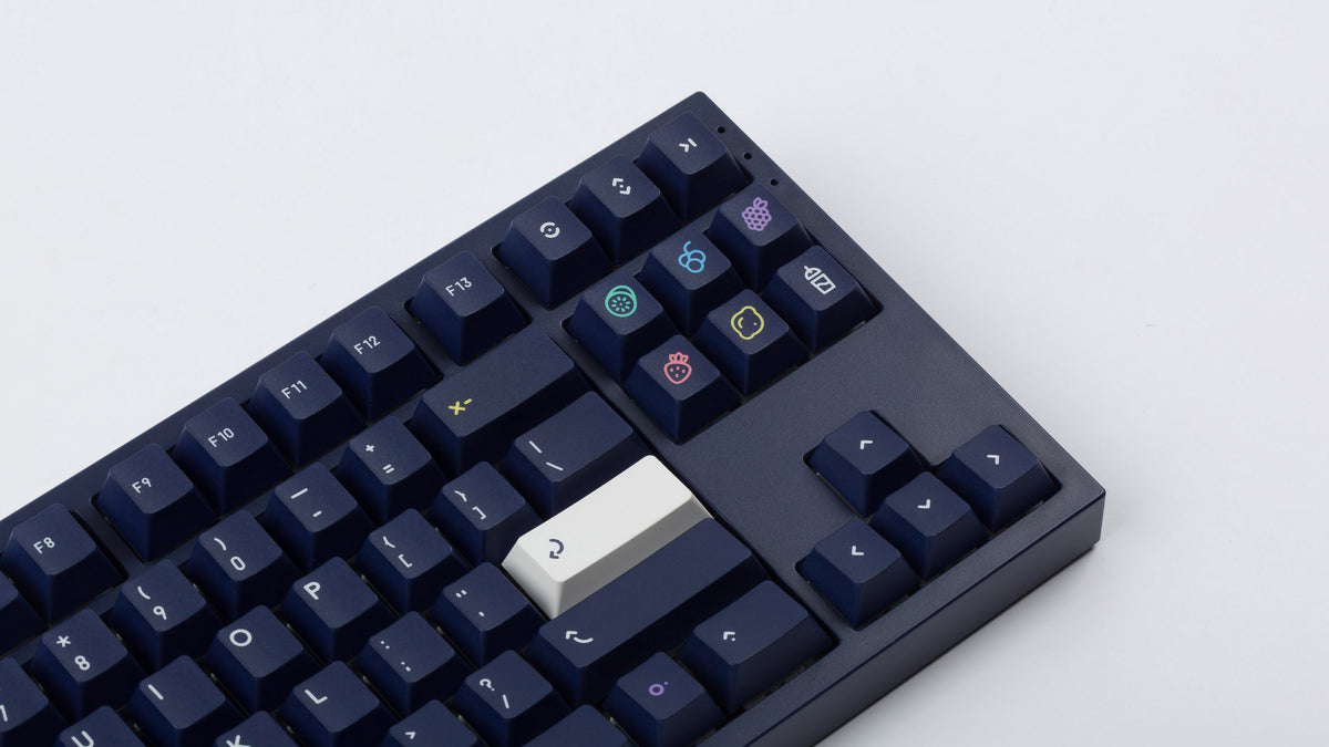  dark blue NK87 case with included dark milkshake themed keycaps  close up of right side 