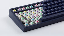 Load image into Gallery viewer, dark blue NK87 case with included dark milkshake themed keycaps and exposed switches